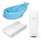 Care essentials baby gear rental bundle in Panama with baby bathtub, changing pad, and diaper pail on a white background.