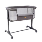 Modena bedside bassinet for baby rental in Panama with side storage pocket open for easy access to baby essentials.